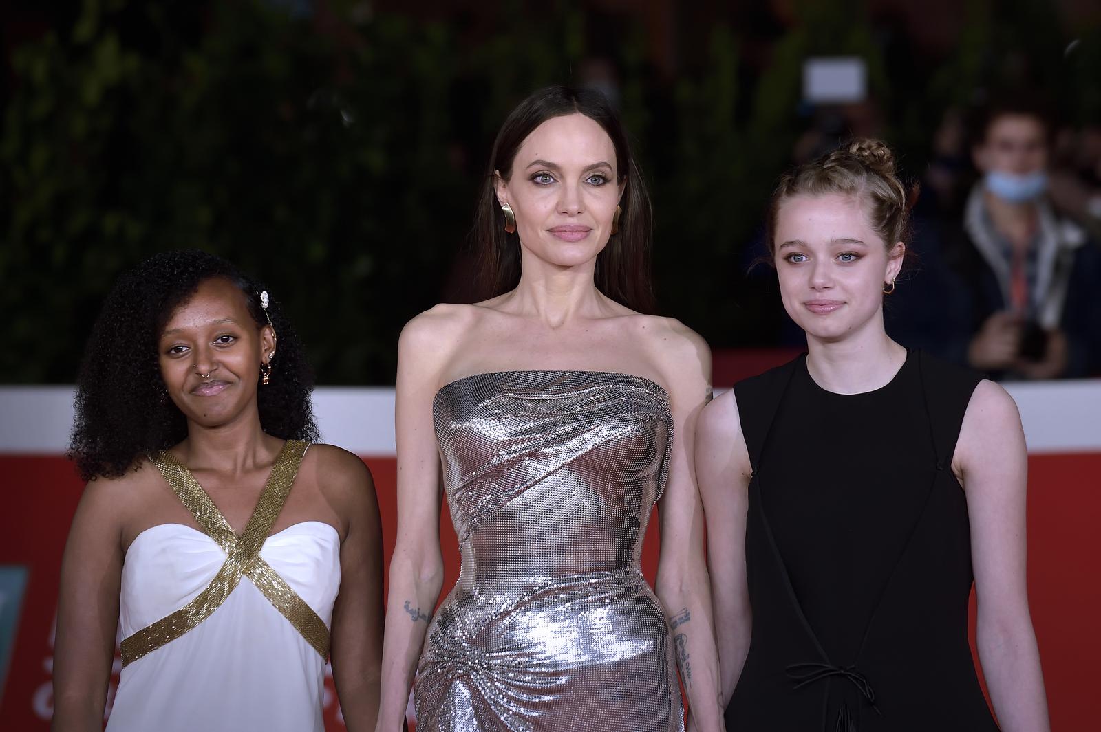 ROME, ITALY - OCTOBER 24 Zahara Marley Jolie-Pitt, Angelina Jolie ,Shiloh Jolie-Pitt,attends the red carpet of the movie "Eternals" during the 16th Rome Film Fest 2021 on October 24, 2021 in Rome, Italy.