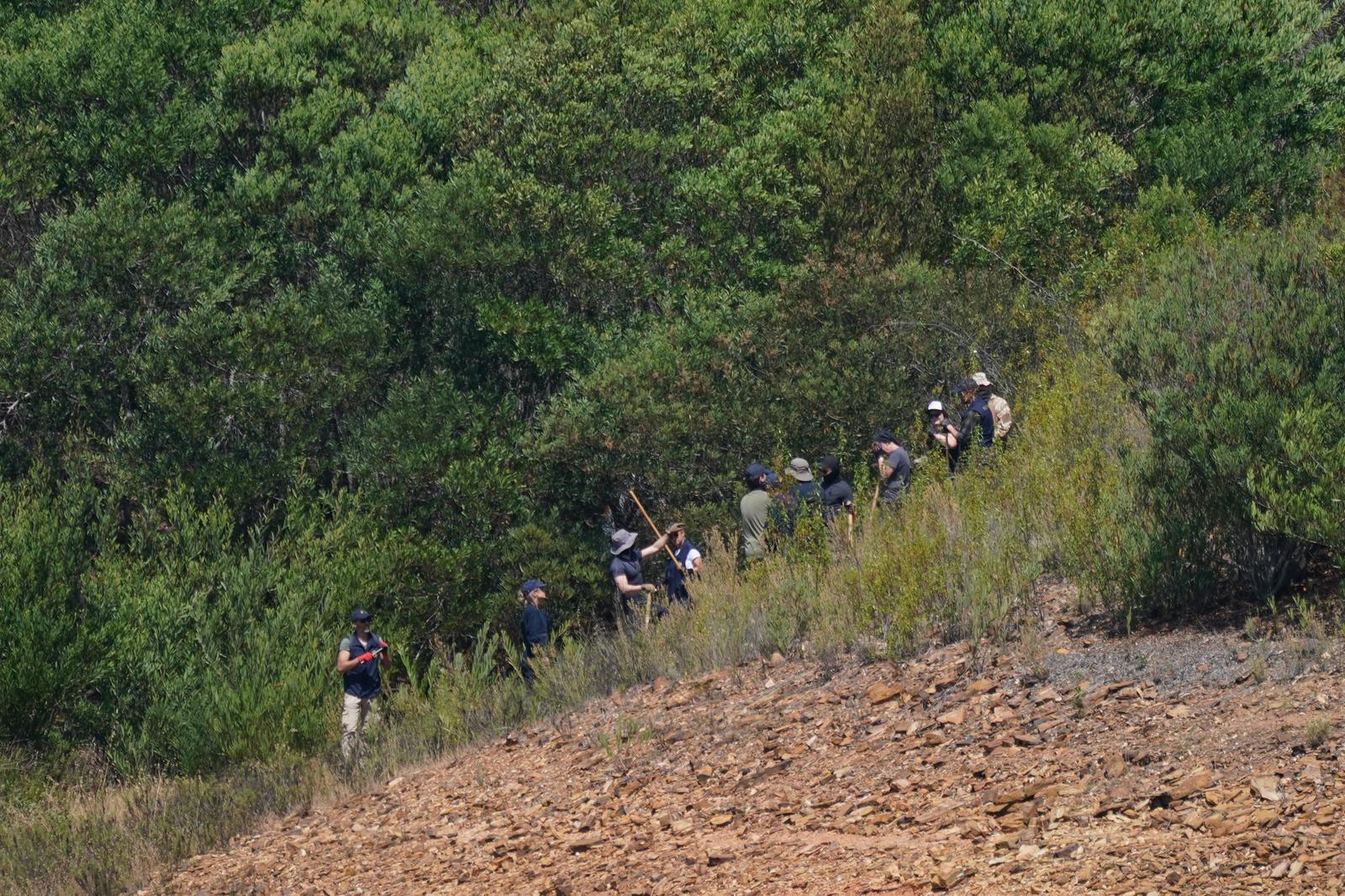 Personnel at Barragem do Arade reservoir, in the Algave, Portugal, as searches continue as part of the investigation into the disappearance of Madeleine McCann. The area is around 50km from Praia da Luz where Madeleine went missing in 2007. Picture date: Thursday May 25, 2023. Photo: Yui Mok/PRESS ASSOCIATION