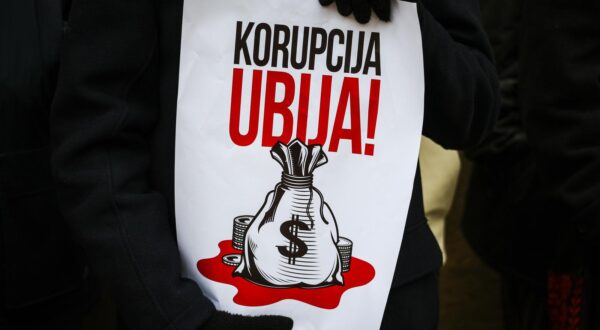 A placard saying in Serbian, Corruption kills seen during the demonstration. Serbian students of the Jagiellonian University demonstrated in solidarity with their colleagues from their homeland, who started protests against corruption in the government after the tragedy in Novi Sad, where local railway station collapsed. 15 people were killed in the disaster, and later findings indicated links between the construction company and the ruling party. (Photo by Filip Radwanski / SOPA Images/Sipa USA) Photo: SOPA Images/SIPA USA