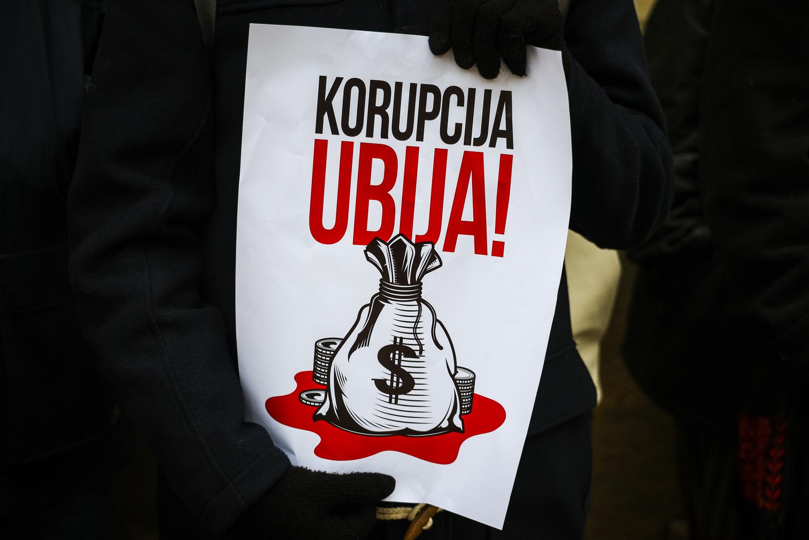 A placard saying in Serbian, Corruption kills seen during the demonstration. Serbian students of the Jagiellonian University demonstrated in solidarity with their colleagues from their homeland, who started protests against corruption in the government after the tragedy in Novi Sad, where local railway station collapsed. 15 people were killed in the disaster, and later findings indicated links between the construction company and the ruling party. (Photo by Filip Radwanski / SOPA Images/Sipa USA) Photo: SOPA Images/SIPA USA