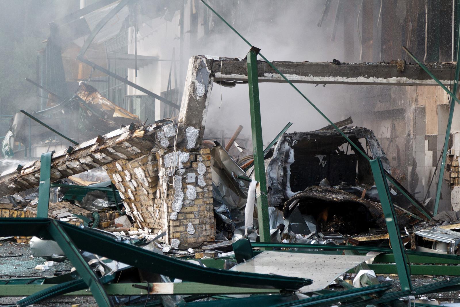A burnt-out car is near an office building in the Shevchenkivskyi district, which caught fire as a result of an overnight Russian attack, Kyiv, Ukraine, June 10, 2025. Photo by Kirill Chubotin/Ukrinform/ABACAPRESS.COM Photo: Chubotin Kirill/Ukrinform/ABACA/ABACA