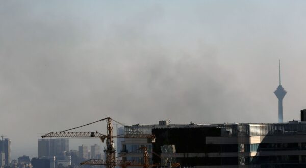 epa12183876 Smoke rises near the Milad Tower following an Israeli airstrike on Tehran, Iran, 18 June 2025. Israel and Iran have been exchanging fire since Israel launched strikes across Iran on 13 June 2025 as part of Operation 'Rising Lion.'  EPA/ABEDIN TAHERKENAREH