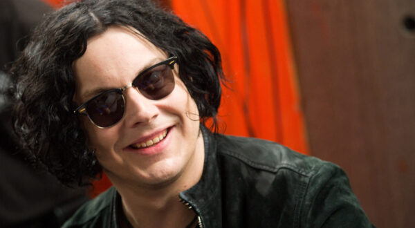 FILE - In this June 24, 2011 file photo, Jack White signs copies of the record he made with Stephen Colbert in New York. The former White Stripe has released his first solo album, Blunderbuss." (AP Photo/Charles Sykes, File)