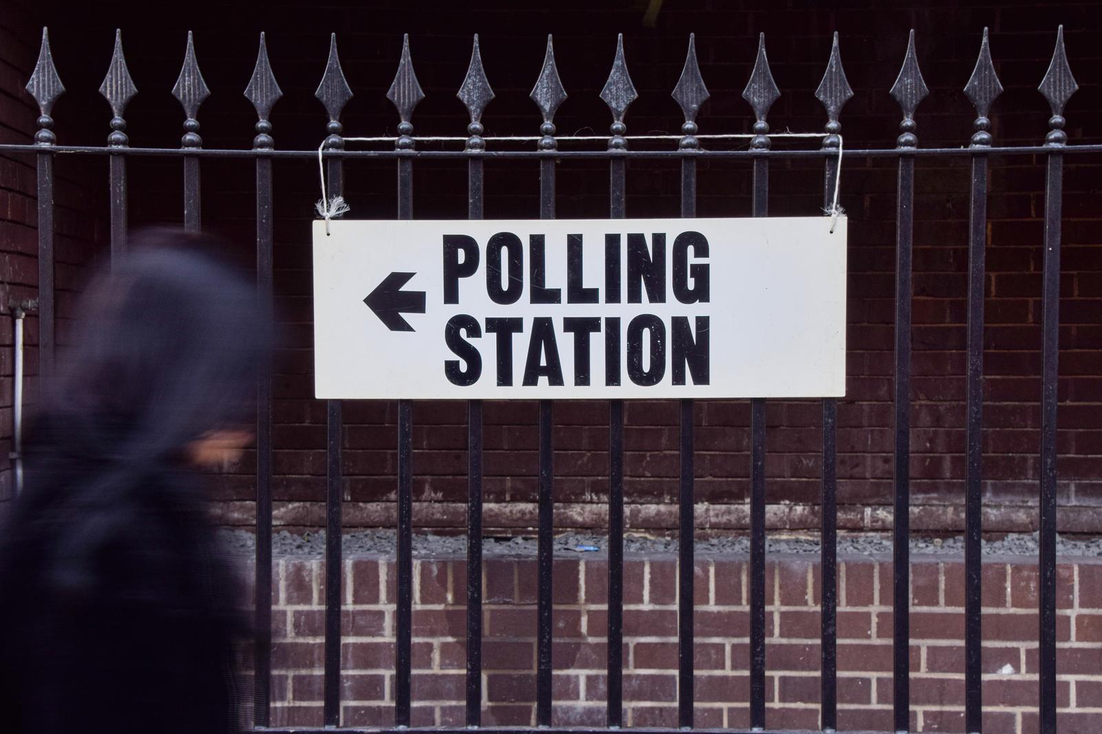 A person walks past a sign at a polling station in Central London as polls open in the UK general election. (Photo by Vuk Valcic / SOPA Images/Sipa USA) Photo: SOPA Images/SIPA USA
