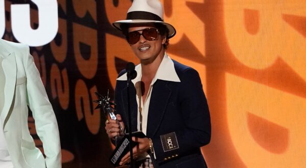 Bruno Mars accepts the award for album of the year for "An Evening with Silk Sonic" at the BET Awards on Sunday, June 26, 2022, at the Microsoft Theater in Los Angeles. (AP Photo/Chris Pizzello) 2022 BET Awards - Show