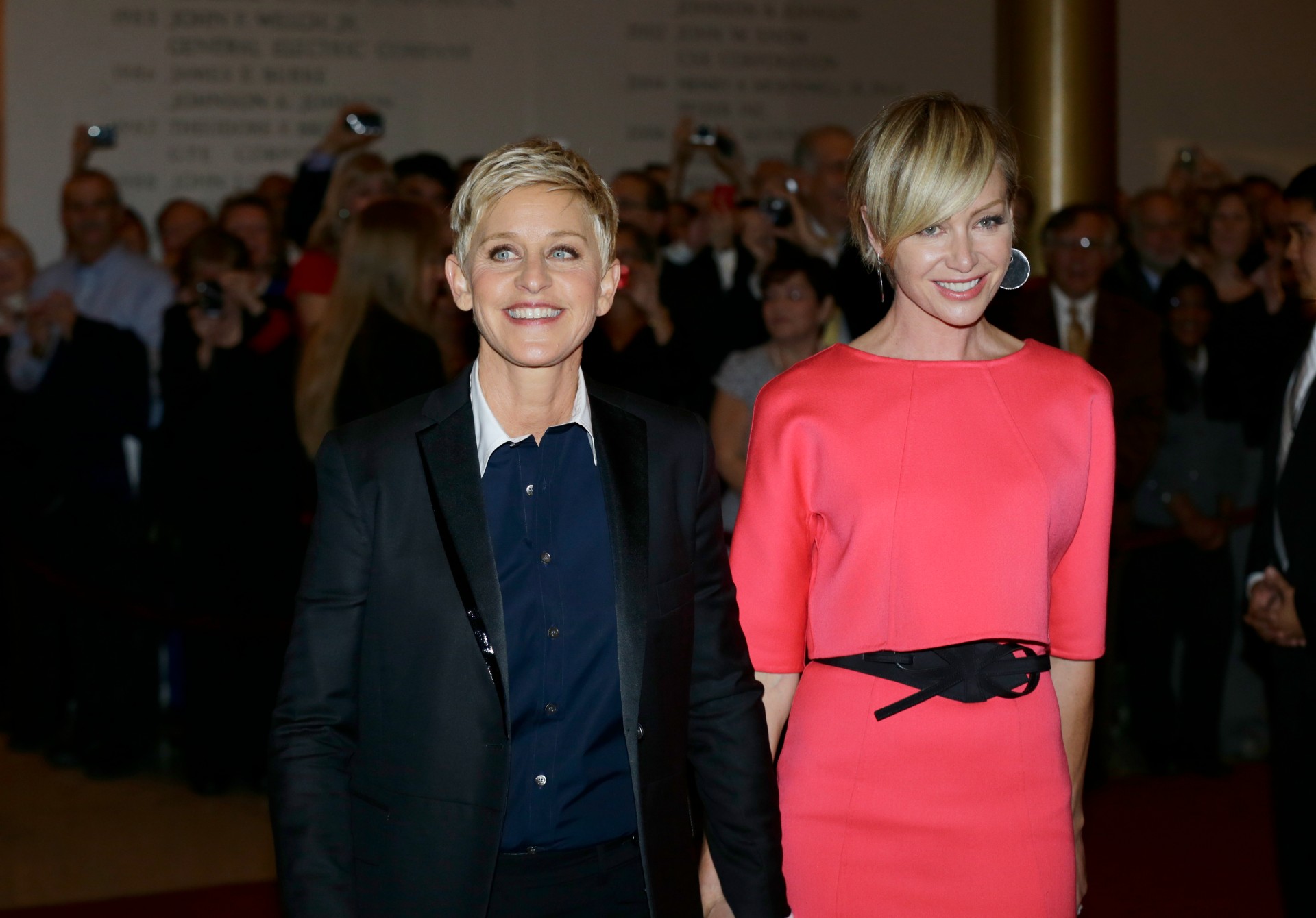 Entertainer Ellen DeGeneres, left, with her wife Portia de Rossi, pose for photographers on the red carpet before DeGeneres receives the 15th annual Mark Twain Prize for American Humor at the Kennedy Center, Monday, Oct. 22, 2012, in Washington. (AP Photo/Alex Brandon) Humor Prize Ellen DeGeneres