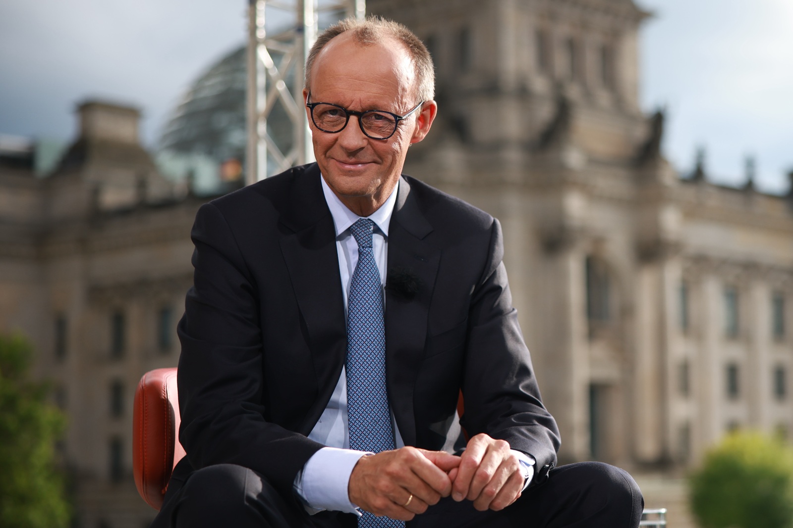 epa12235961 German Chancellor Friedrich Merz poses after the summer interview with public broadcaster ARD in Berlin, Germany, 13 July 2025.  EPA/CLEMENS BILAN