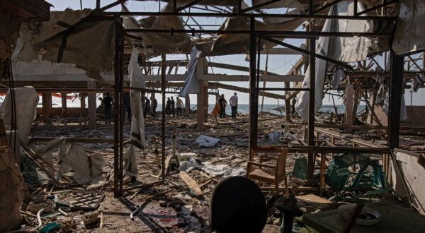 epa12206626 Palestinians inspect the site of an Israeli airstrike that targeted Al-Baqa Cafe, located on the seafront of Gaza City in the western part of the city, 30 June 2025. According to the Gaza Ministry of Health, the strike resulted in the death of 24 Palestinians.  EPA/HAITHAM IMAD