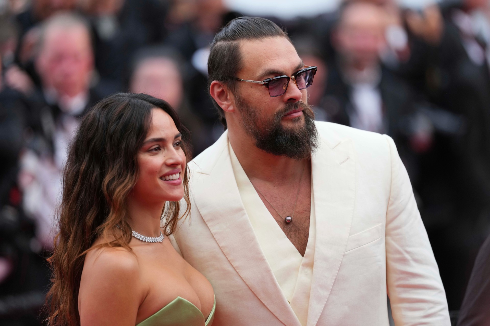 Adria Arjona, left, and Jason Momoa pose for photographers upon arrival at the premiere of the film 'Highest 2 Lowest' at the 78th international film festival, Cannes, southern France, Monday, May 19, 2025. (Photo by Lewis Joly/Invision/AP) France Cannes 2025 Highest 2 Lowest Red Carpet