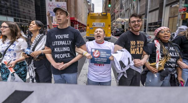 NEW YORK, NEW YORK - APRIL 22: Climate activists block the street outside U.S. billionaire Bill Ackman's Manhattan residence during "Bye Bye Billionaires Block Party" protest on Earth Day?, April 22, 2025? in New York City. (Photo by Michael Nigro/Sipa USA) Photo: Michael Nigro/SIPA USA