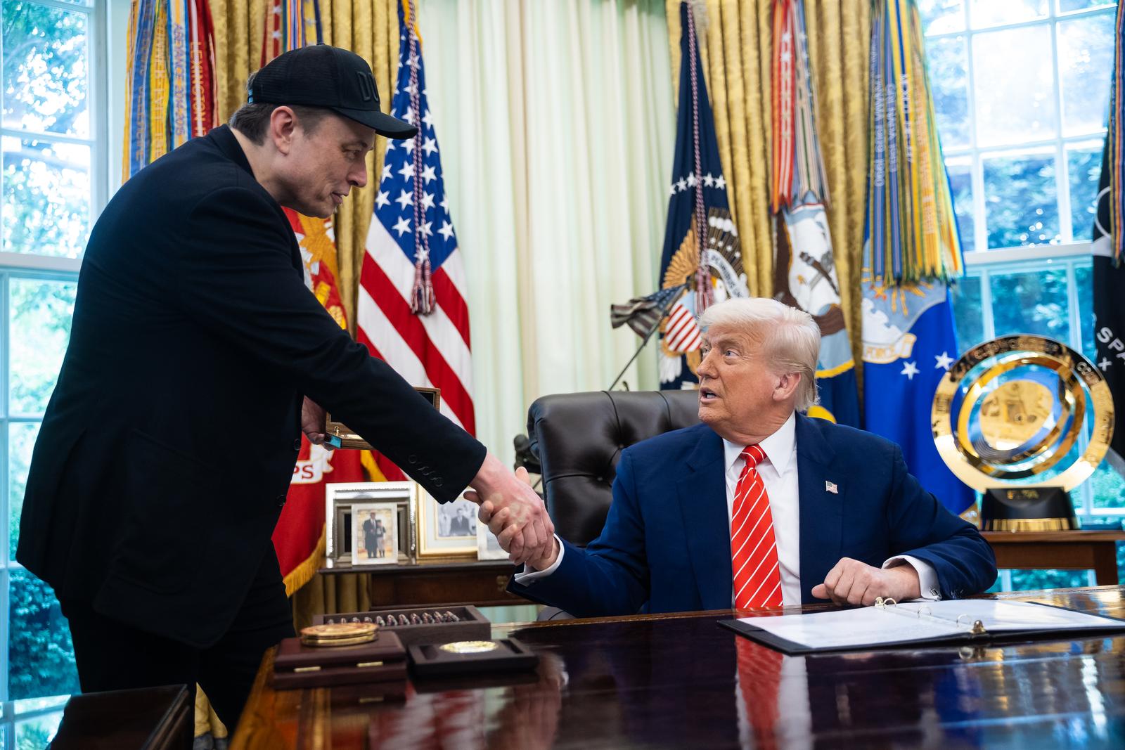 United States President Donald J Trump, right, and Elon Musk, Chief Executive Officer, Tesla, SpaceX and X (previously known as Twitter) and Administrator, Department of Government Efficiency (DOGE), left, shake hands as they participate in a press conference in the Oval Office of the White House in Washington, DC, US,, May 30, 2025. 
Credit: Francis Chung / Pool via CNP/AdMedia Photo: CNP/AdMedia/NEWSCOM