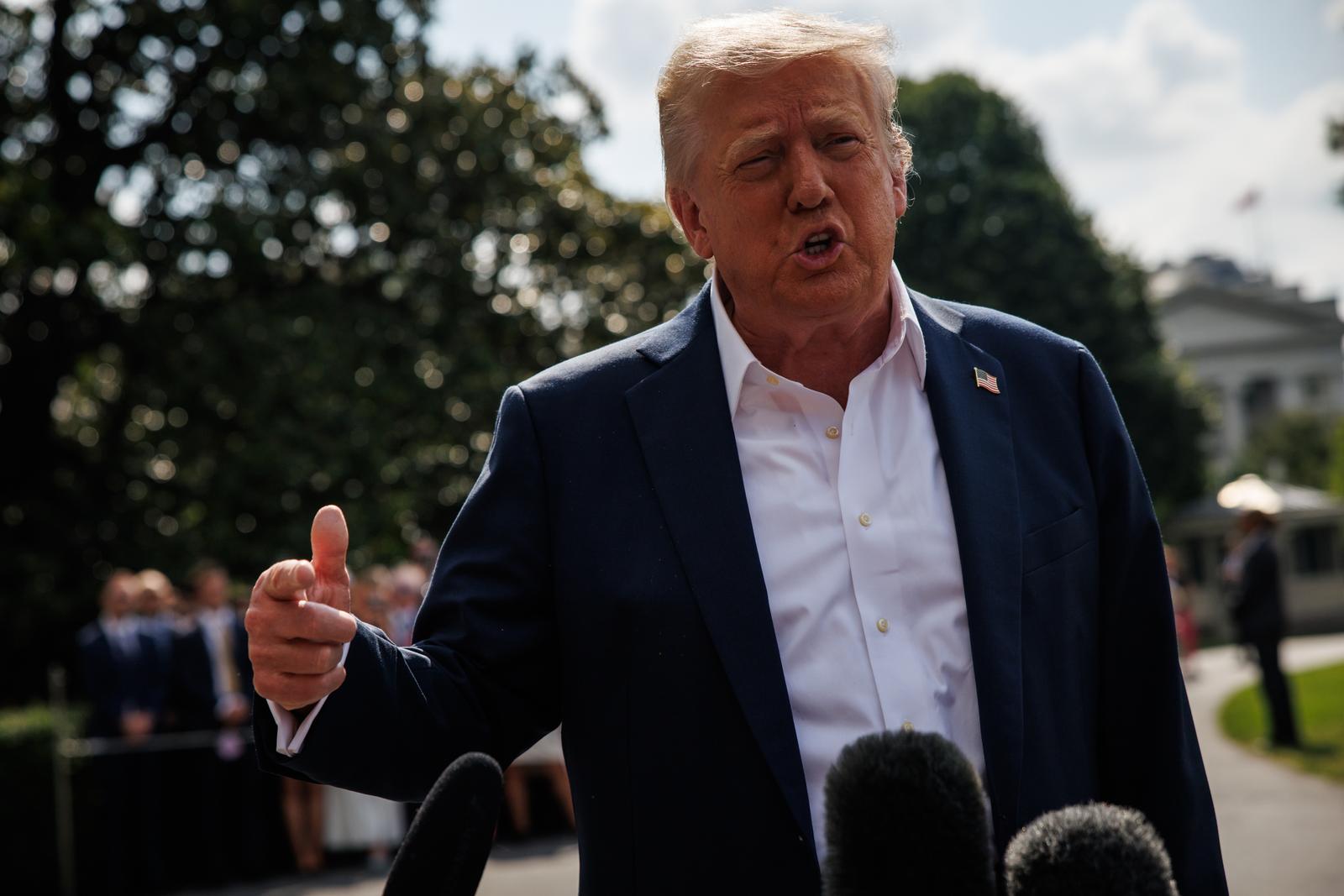 United States President Donald J Trump responds to questions from reporters after walking out of the South Portico of the White House to board Marine One on the South Lawn on July 11, 2025 in Washington, D.C. The President and First Lady are heading to Kerrville, Texas, to meet with local officials and first responders after a deadly flash flood a week ago killed at least 120 people with at least 160 people still missing. 
Credit: Samuel Corum / Pool via CNP/AdMedia Photo: CNP/AdMedia/NEWSCOM