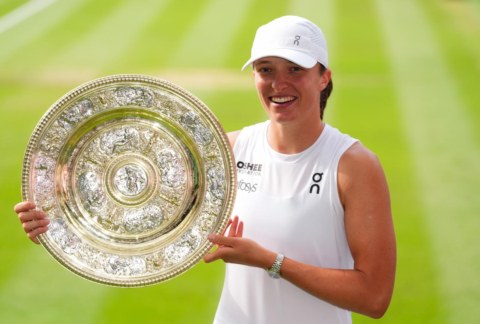 Iga Swiatek with the Venus Rosewater Dish following her Ladies' Singles Final victory over Amanda Anisimova on day thirteen of the 2025 Wimbledon Championships at the All England Lawn Tennis and Croquet Club, London. Picture date: Saturday July 12, 2025. Photo: Adam Davy/PRESS ASSOCIATION