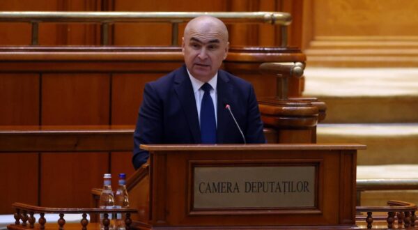 (250624) -- BUCHAREST, June 24, 2025 (Xinhua) -- Ilie Bolojan delivers a speech during an investiture vote session at the Parliament Palace in Bucharest, Romania, June 23, 2025. Romania's new pro-European government, led by Prime Minister Ilie Bolojan, was sworn in Monday evening before President Nicusor Dan, marking the end of a period of political instability and interim leadership.    The new cabinet is backed by a broad ruling coalition comprising the Social Democratic Party (PSD), National Liberal Party (PNL), Save Romania Union (USR), and the Hungarian Democratic Union of Romania (UDMR). Earlier in the day, the coalition secured a strong parliamentary mandate with 301 votes in favor and only 9 against. (Photo by Cristian Cristel/Xinhua) Photo: Cristian Cristel/XINHUA