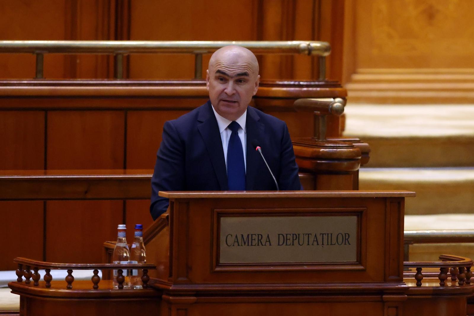 (250624) -- BUCHAREST, June 24, 2025 (Xinhua) -- Ilie Bolojan delivers a speech during an investiture vote session at the Parliament Palace in Bucharest, Romania, June 23, 2025. Romania's new pro-European government, led by Prime Minister Ilie Bolojan, was sworn in Monday evening before President Nicusor Dan, marking the end of a period of political instability and interim leadership.    The new cabinet is backed by a broad ruling coalition comprising the Social Democratic Party (PSD), National Liberal Party (PNL), Save Romania Union (USR), and the Hungarian Democratic Union of Romania (UDMR). Earlier in the day, the coalition secured a strong parliamentary mandate with 301 votes in favor and only 9 against. (Photo by Cristian Cristel/Xinhua) Photo: Cristian Cristel/XINHUA