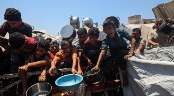 (250724) -- GAZA, July 24, 2025 (Xinhua) -- Palestinians wait to receive free food from a charity kitchen in Gaza City, on July 24, 2025. The Palestinians are facing "the biggest humanitarian catastrophe" of their time amid the ongoing conflict in Gaza and the West Bank, due to the failure of global efforts to deter Israeli actions, Palestinian President Mahmoud Abbas said Thursday. (Photo by Rizek Abdeljawad/Xinhua) Photo: Rizek Abdeljawad/XINHUA