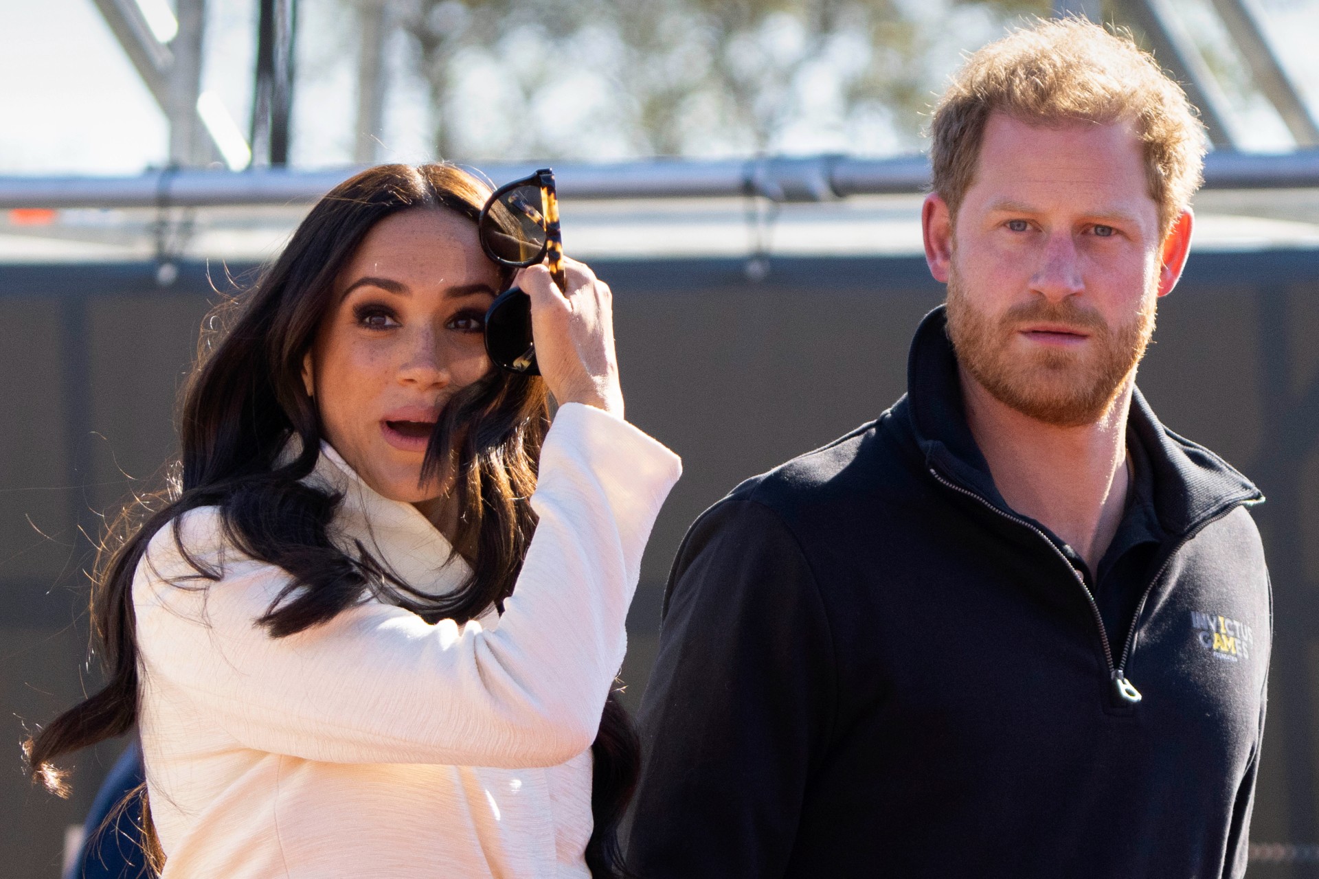 FILE - Prince Harry and Meghan Markle, Duke and Duchess of Sussex visit the track and field event at the Invictus Games in The Hague, Netherlands, Sunday, April 17, 2022. Prince Harry and his wife, Meghan, are expected to vent their grievances against the monarchy when Netflix releases the final episodes of a series about the couple’s decision to step away from royal duties and make a new start in America. (AP Photo/Peter Dejong, File) Britain Royals