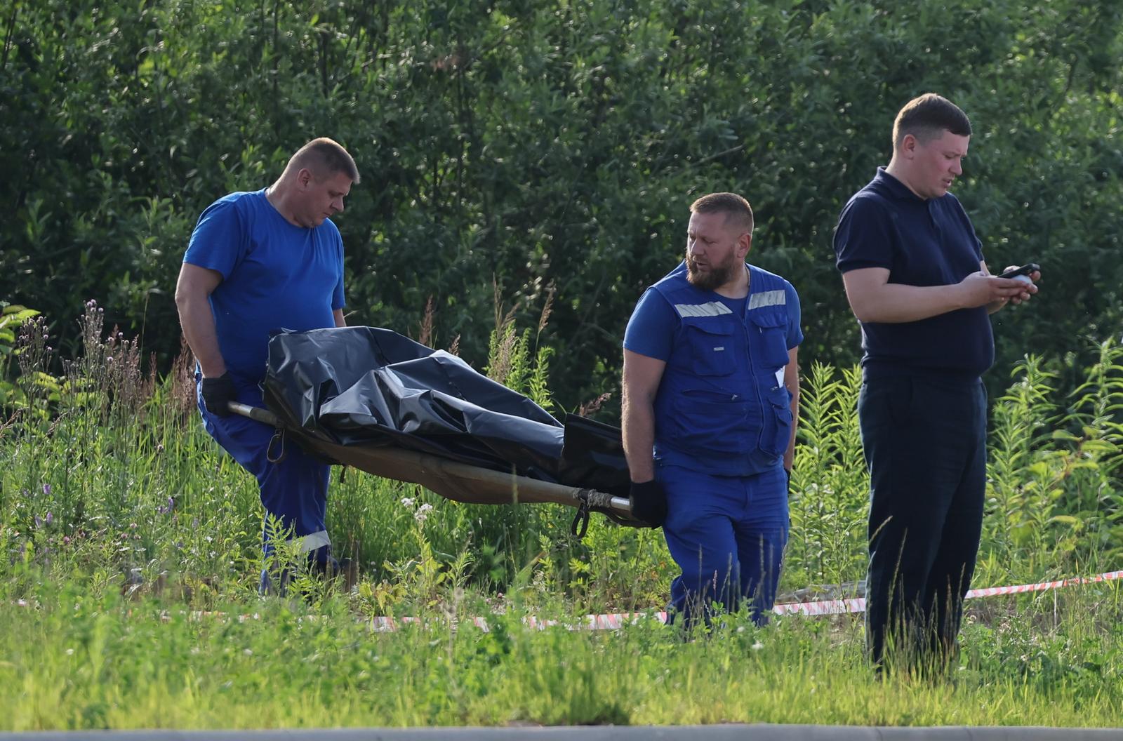 RUSSIA, MOSCOW REGION - JULY 7, 2025: A security service employee is seen as funeral service employees carry the body of former Russian Transport Minister Roman Starovoit. According to the Russian Investigative Committee, the body of Roman Starovoit with a gunshot wound was found in his car, the main version is suicide.  Sergei Savostyanov/TASS/Sipa USA Photo: Tass/SIPA USA