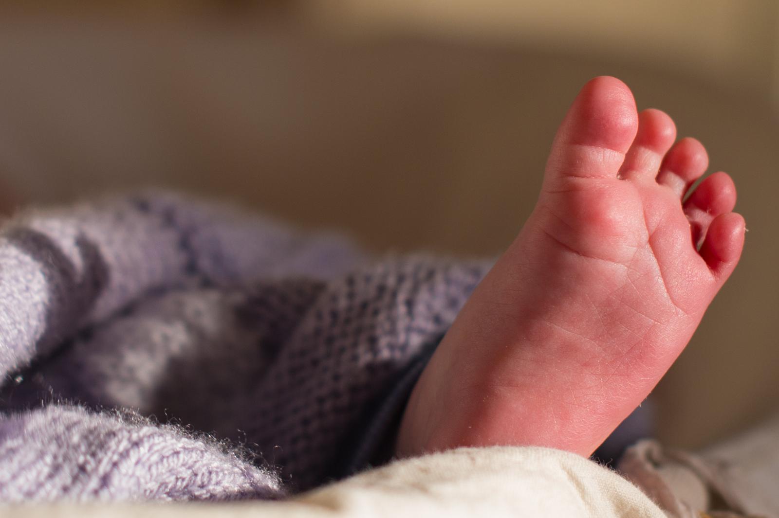 EMBARGOED TO 0001 MONDAY MAY 12 Undated file photo of the foot of a baby sleeping in a basket. An NHS programme to prevent brain injuries during childbirth is set to be rolled out across the country. The Avoiding Brain Injuries in Childbirth (ABC) programme will assist maternity staff to better identify signs that the baby is in distress during labour so they can act quickly, the Department of Health and Social Care (DHSC) said. Issue date: Monday May 12, 2025. Photo: Dominic Lipinski/PRESS ASSOCIATION