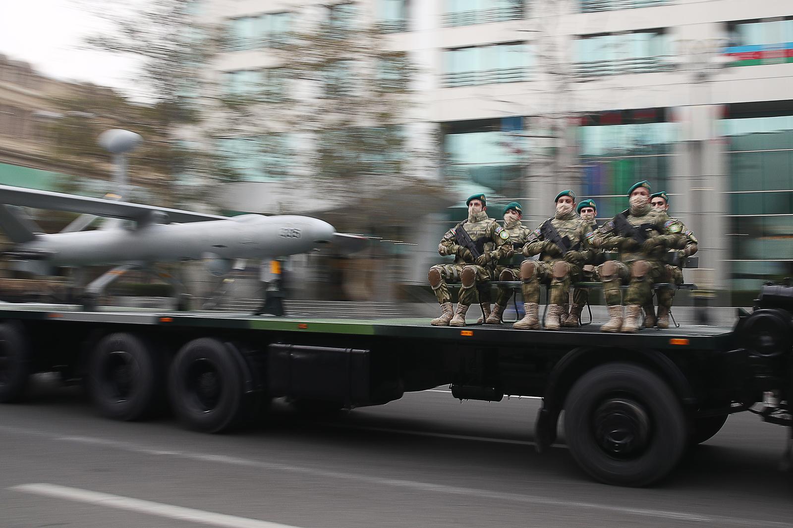 BAKU, AZERBAIJAN - DECEMBER 8, 2020: Azerbaijani servicemen are seen by a Elbit Hermes 450 unmanned aerial vehicle designed for tactical long endurance missions by Israel Aircraft Industries during a rehearsal of a military parade in Freedom Square. The parade to mark the end of the military conflict over the disputed Caucasus Mountains territory of Nagorno-Karabakh is scheduled for December 10. Valery Sharifulin/TASS Photo via Newscom Newscom/PIXSELL
