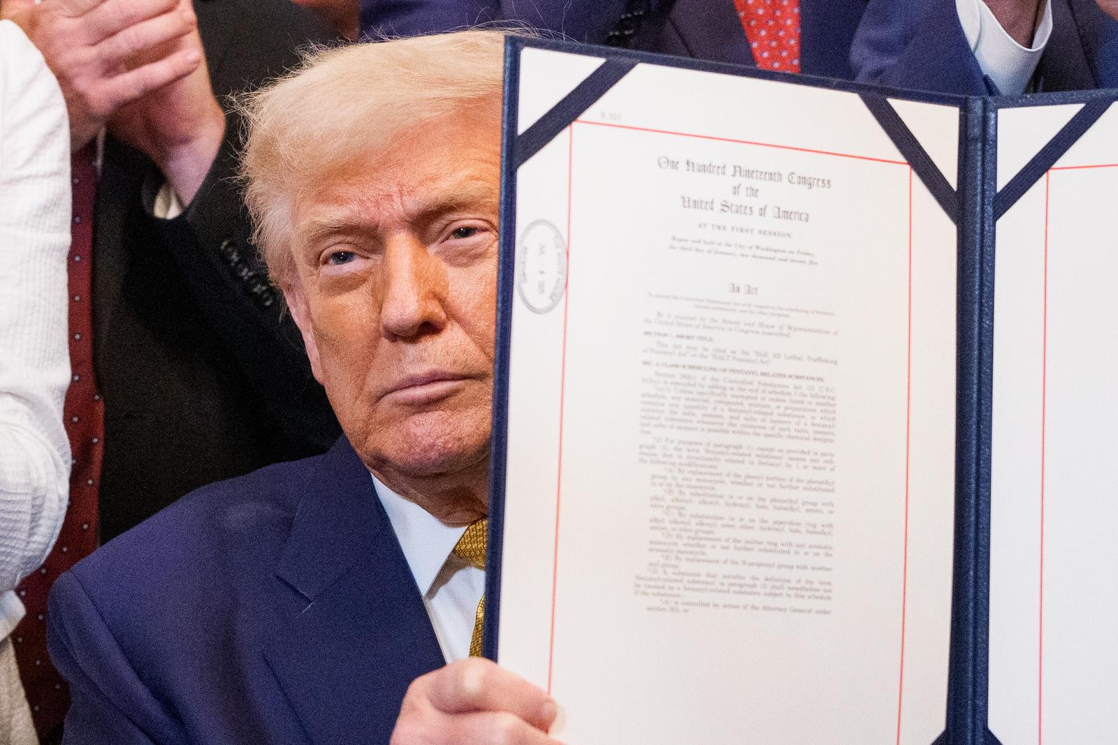 United States President Donald J Trump displays his signed bill during a signing ceremony for âThe Halt All Lethal Trafficking of Fentanyl Actâ in the East Room of the White House in Washington, DC, US, on Wednesday, July 16, 2025. The bill strengthens prison sentences for fentanyl traffickers and reclassifies the drug as a Schedule I substance. Credit: Aaron Schwartz / Pool via CNP