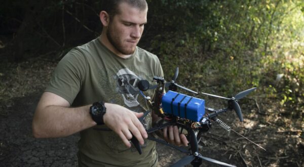 epa12271483 A Ukrainian pilot prepares an FPV drone on an attack mission at a frontline near the city of Chasiv Yar, Donetsk region, Ukraine, 29 July 2025.  EPA/SERGEY SHESTAK