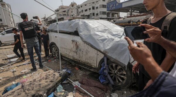 epa12293401 The damaged car of Al Jazeera journalist Anas Al-Sharif as Palestinians inspect the destroyed tent of the Al Jazeera team following an Israeli strike, outside the Al-Shifa Hospital in Gaza City, 11 August 2025. At least seven people, including five Al Jazeera media team members Anas Al-Sharif, Mohammed Qreiqeh, Ibrahim Zaher, Moamen Aliwa and Mohammed Noufal, were killed in an Israeli strike on their tent outside Gaza's Al-Shifa Hospital late 10 August 2025. The Israel Defense Forces (IDF) claimed direct responsibility for the attack.  EPA/MOHAMMED SABER