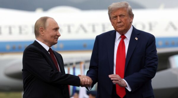 epa12303633 US President Donald Trump (R) and Russian President Vladimir Putin pose on the podium on the tarmac after they arrived to attend a meeting at Joint Base Elmendorf-Richardson in Anchorage, Alaska, USA, 15 August 2025.  EPA/GAVRIIL GRIGOROV/SPUTNIK/KREMLIN POOL / POOL MANDATORY CREDIT