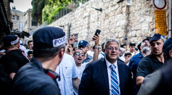 Israeli Minister of National Security Itamar Ben-Gvir, center, looks on as he marches through the  Muslim quarter of Jerusalem's old walled city. Tens of thousands of young religious-Zionist and right wing men and women marched through the capital waving Star of David flags entering the Old City of Jerusalem through the Muslim Quarter, as part of a controversial flag march, marking the reunification of the city during the Six Day War and Israel's capture of the Temple Mount and the Western Wall, Judaism's holiest sites. (Photo by Eyal Warshavsky / SOPA Images/Sipa USA) Photo: SOPA Images/SIPA USA