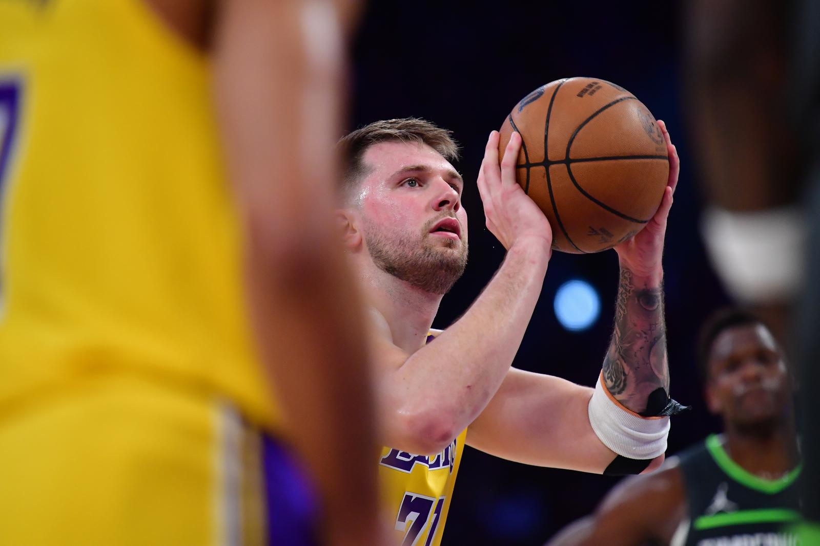 Apr 30, 2025; Los Angeles, California, USA; Los Angeles Lakers guard Luka Doncic (77) shoots a free throw against the Minnesota Timberwolves during the first half in game five of first round for the 2025 NBA Playoffs at Crypto.com Arena. Mandatory Credit: Gary A. Vasquez-Imagn Images/Sipa USA Photo: Imagn Images/SIPA USA