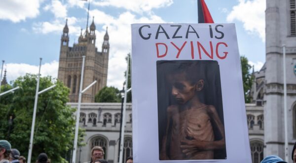 A protester holds a placard with a photo about a starving child in Gaza during the demonstration. Demonstrators gathered on the Parliament Square in London, UK. The protesters aim was to show their support to the Palestine Action and also, to demand from the British government to take the organisation off from the terrorist list. (Photo by Krisztian Elek / SOPA Images/Sipa USA) Photo: SOPA Images/SIPA USA