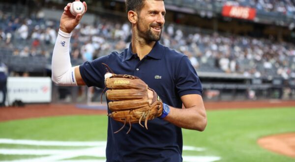 Aug 21, 2025; Bronx, New York, USA;  Professional tennis player Novak Djokovic prepares to throw out the first pitch prior to the game between the Boston Red Sox and the New York Yankees at Yankee Stadium. Mandatory Credit: Wendell Cruz-Imagn Images/Sipa USA 
  Photo: Imagn Images/SIPA USA