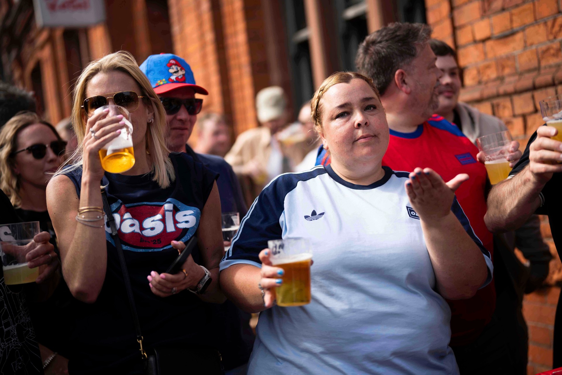 Fans gather for the Oasis reunion concert on Friday, July 4, 2025, in Cardiff. (Photo by Scott A Garfitt/Invision/AP) Britain Oasis Concert