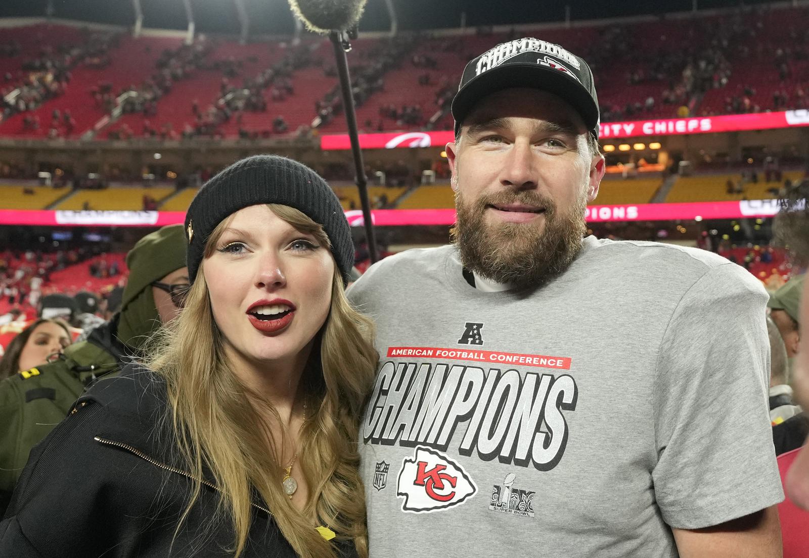 Kansas City Chiefs tight end Travis Kelce and his girlfriend entertainer Taylor Swift stand on the field after the Chiefs defeated the Buffalo Bills 32-29 in the AFC Championship Game at Arrowhead Stadium in Kansas City, Missouri, on Sunday, January 26, 2025. The Chiefs will meet the Philadelphia Eagles in Super Bowl LIX in New Orleans on February 9. Photo by Jon Robichaud/UPI. Photo via Newscom Photo: Jon Robichaud/NEWSCOM