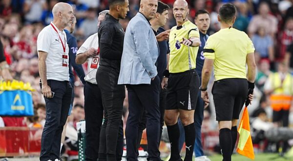 Referee Anthony Taylor speaks with Liverpool manager Arne Slot (left) and Bournemouth manager Andoni Iraola after Bournemouth's Antoine Semenyo (not pictured) informs the referee of a possible racial comment from the crowd during the Premier League match at Anfield, Liverpool. Picture date: Friday August 15, 2025. Photo: Peter Byrne/PRESS ASSOCIATION