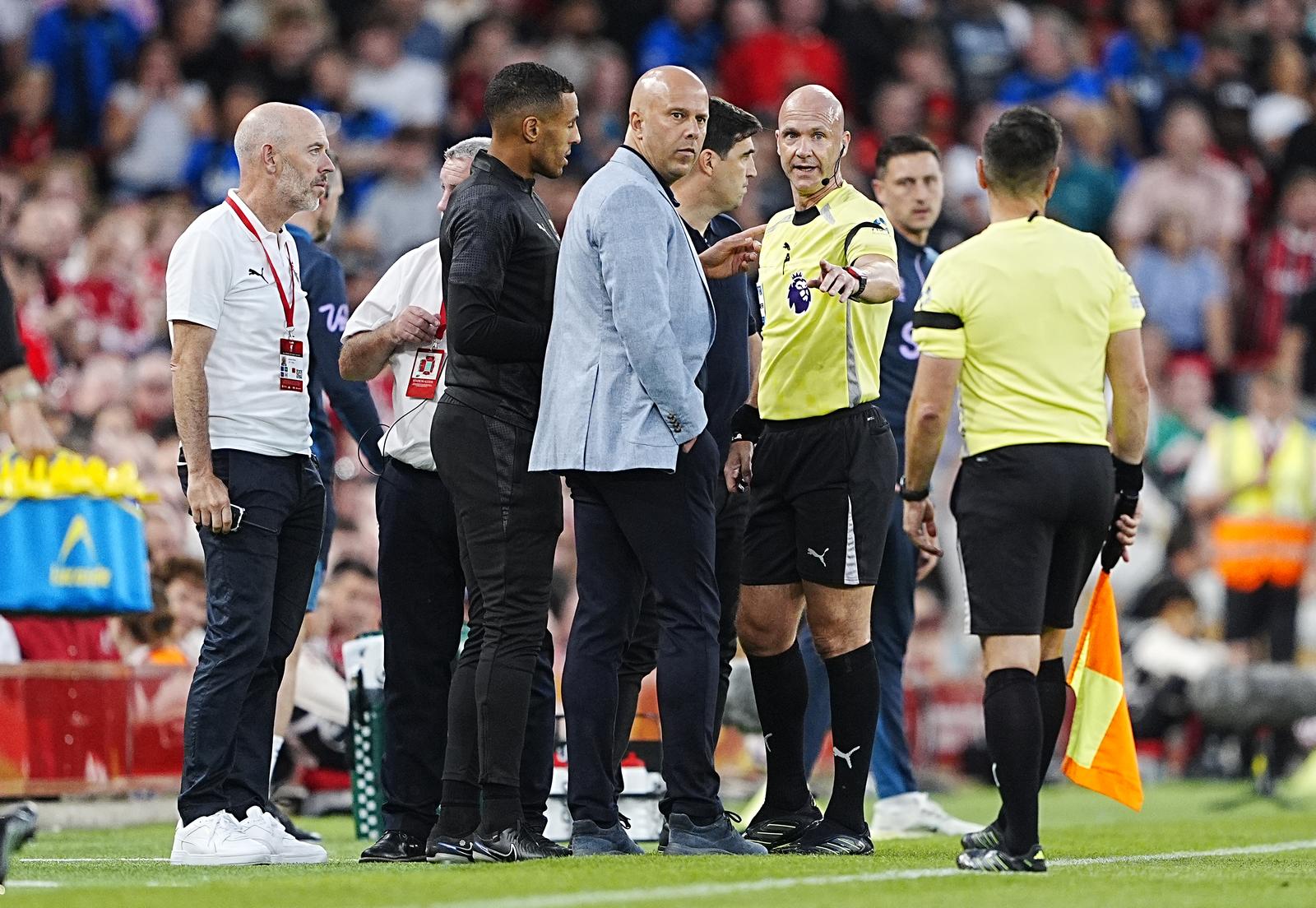 Referee Anthony Taylor speaks with Liverpool manager Arne Slot (left) and Bournemouth manager Andoni Iraola after Bournemouth's Antoine Semenyo (not pictured) informs the referee of a possible racial comment from the crowd during the Premier League match at Anfield, Liverpool. Picture date: Friday August 15, 2025. Photo: Peter Byrne/PRESS ASSOCIATION