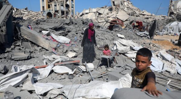 (250806) -- GAZA, Aug. 6, 2025 (Xinhua) -- Palestinians are seen among the rubble after an Israeli airstrike in the Sheikh Radwan area, northwest of Gaza City, on Aug. 6, 2025. At least 27 Palestinians were killed in Israeli attacks on Wednesday, while 20 others died in a food truck overturn in the Gaza Strip, according to Palestinian sources. (Photo by Rizek Abdeljawad/Xinhua) Photo: Rizek Abdeljawad/XINHUA