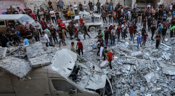 (250831) -- GAZA, Aug. 31, 2025 (Xinhua) -- Palestinians are seen among the rubble of destroyed buildings after an Israeli airstrike in the Al-Rimal area, west of Gaza City, on Aug. 30, 2025.   At least 57 Palestinians were killed by Israeli attacks across the Gaza Strip on Saturday, according to Palestinian sources.   TO GO WITH "Roundup: 57 killed in Israeli attacks across Gaza: sources" (Photo by Rizek Abdeljawad/Xinhua) Photo: Rizek Abdeljawad/XINHUA
