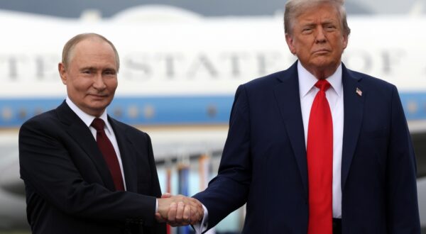 epa12303630 US President Donald Trump (R) and Russian President Vladimir Putin pose on the podium on the tarmac after they arrived to attend a meeting at Joint Base Elmendorf-Richardson in Anchorage, Alaska, USA, 15 August 2025.  EPA/GAVRIIL GRIGOROV/SPUTNIK/KREMLIN POOL / POOL MANDATORY CREDIT