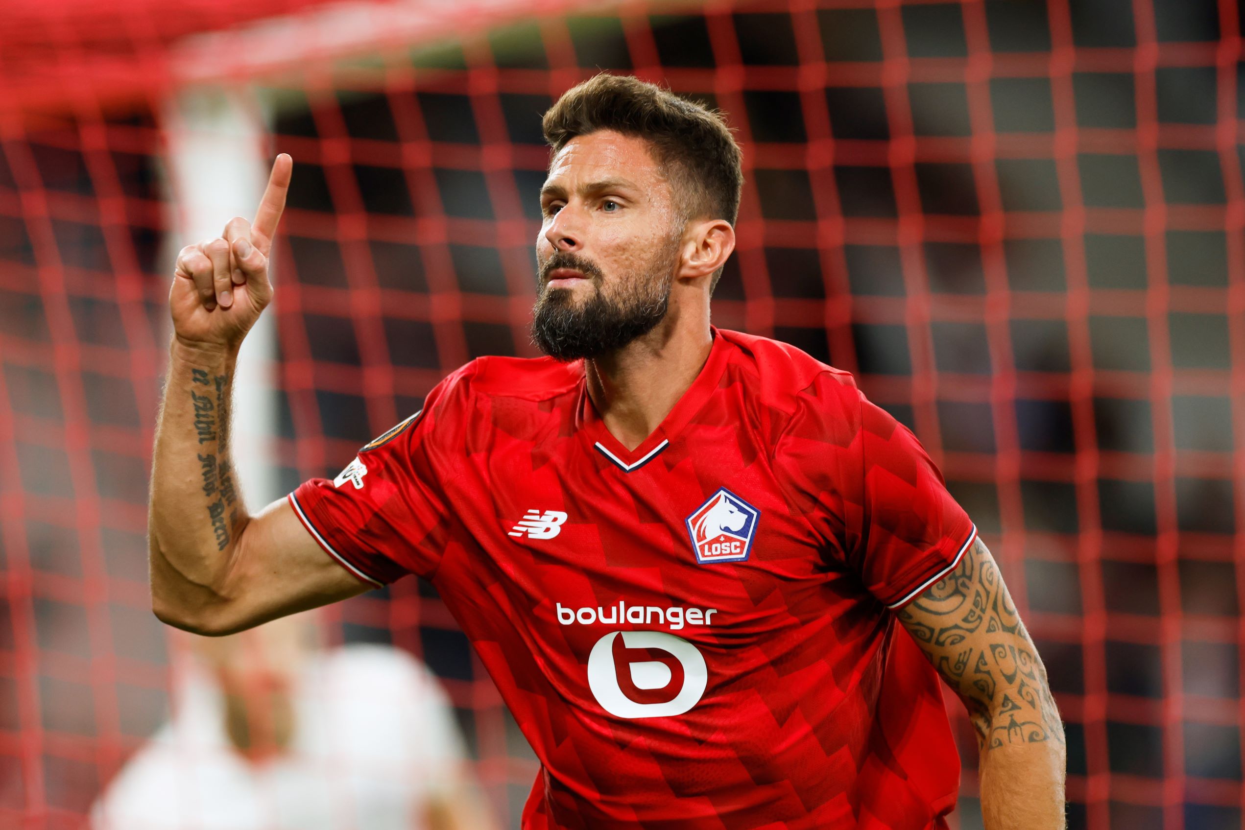 Lille's Olivier Giroud celebrates after scoring his sides second goal during the Europa League soccer match between Lille and Brann at the Pierre Mauroy stadium in Villeneuve d'Ascq, northern France, Thursday, Sept. 25, 2025. (AP Photo/Jean-Francois Badias) France Soccer Europa League