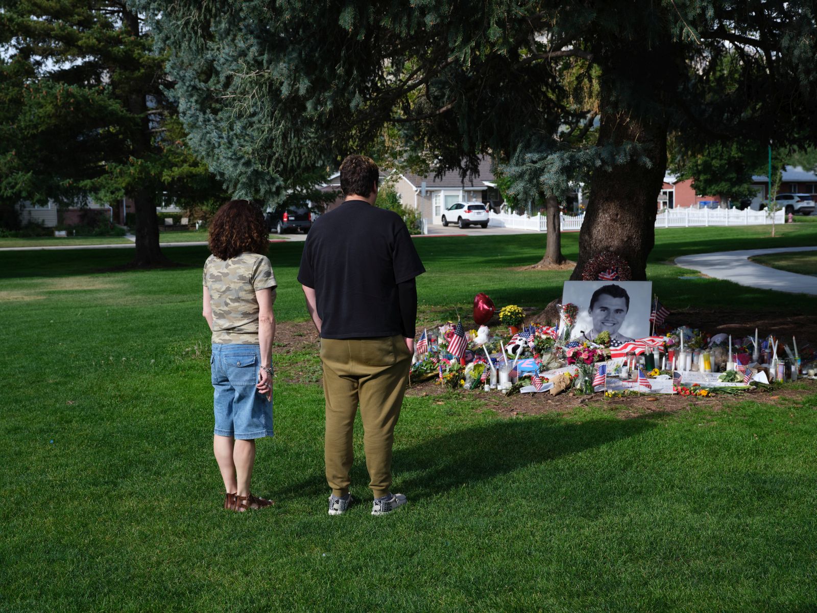 epa12373918 People look at tributes to slain conservative political activist Charlie Kirk, in Provo, Utah, USA, 12 September 2025 (issued 13 September 2025). Kirk was shot and killed on 10 September during a stop on his American Comeback Tour organized by Turning Point USA at Utah Valley University. Tyler Robinson has been arrested and identified as the suspected shooter.  EPA/LINDSAY D'ADDATO