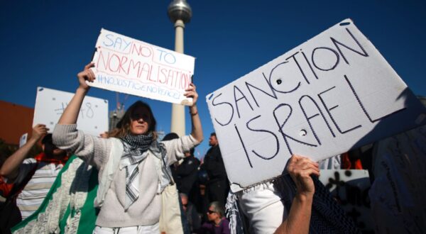 epa12409916 Protesters hold placards during a rally in support of Gaza motivated by the German left-wing party in Berlin, Germany, 27 September 2025. On 27 September 2025, two demonstrations took place in order to express protest on Israel's ongoing operation in the Palestinian Gaza strip. The Left party called for a demonstration under the motto 'Together for Gaza' and an alliance of different organizers called for a rally under the motto 'All Eyes on Gaza - Stop the Genocide!'.  EPA/CLEMENS BILAN