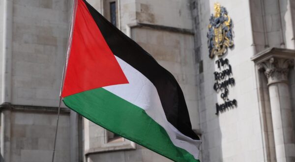 A Palestinian flag outside The Royal Courts Of Justice in central London, where a judge is ruling on whether the co-founder of Palestine Action, Huda Ammori, can proceed with a legal challenge against the Home Secretary's decision to proscribe the group as a terrorist organisation. The ban means that membership of, or support for, the direct action group is now a criminal offence punishable by up to 14 years in prison. Picture date: Wednesday July 30, 2025. Photo: Jonathan Brady/PRESS ASSOCIATION