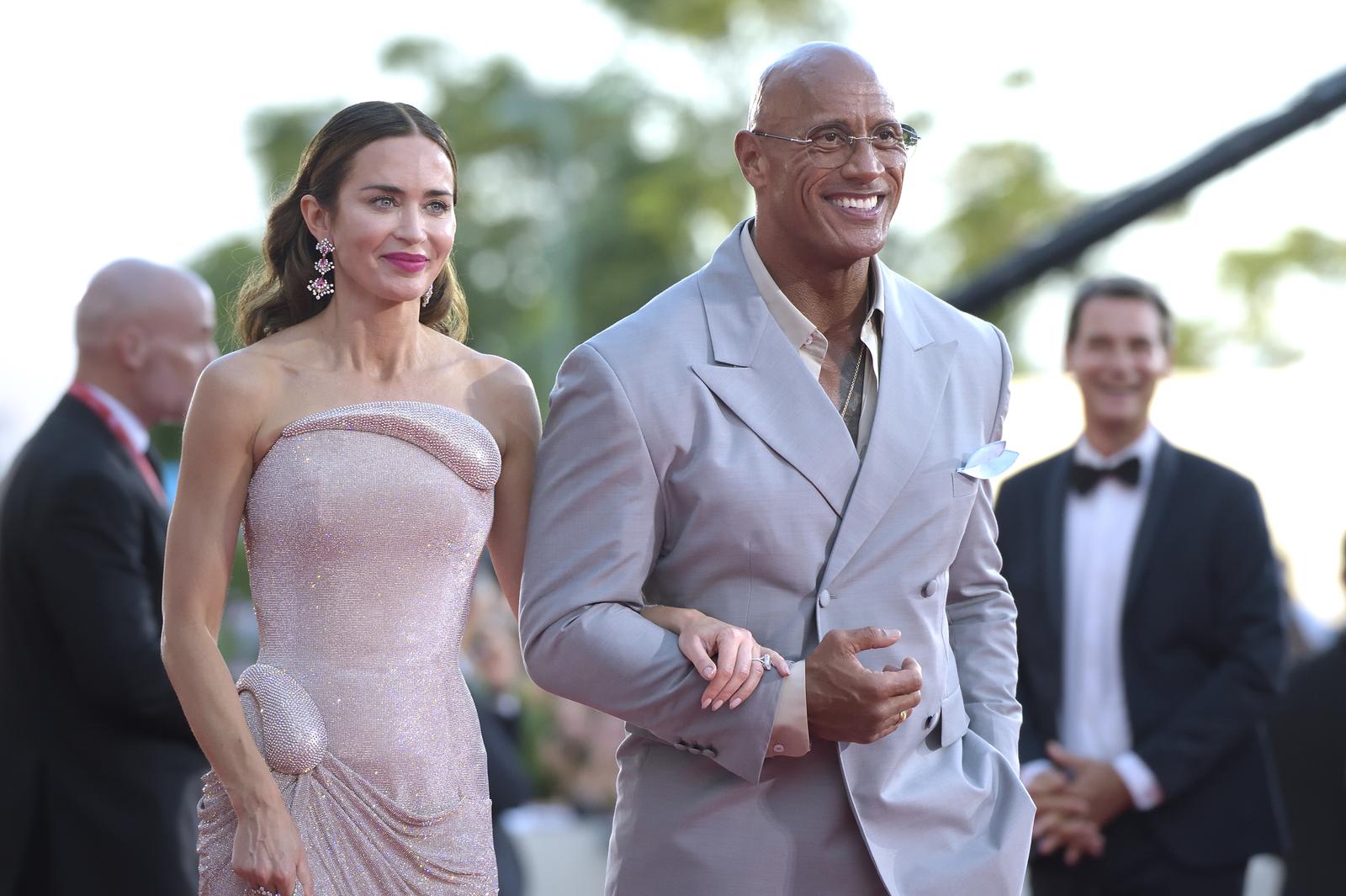 British-born American actress Emily Blunt and American actor and film producer Dwayne Johnson at the 82 Venice International Film Festival 2025. The Smashing Machine Red Carpet. Venice (Italy), September 1st, 2025 (Photo by Rocco Spaziani/Mondadori Portfolio/Sipa USA) Photo: Mondadori Portfolio/SIPA USA