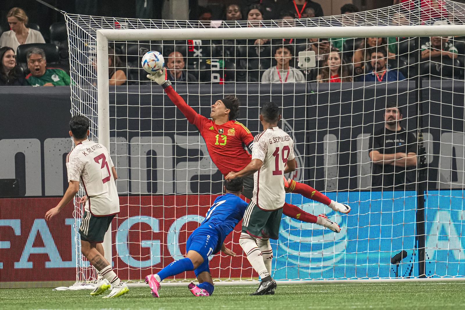 Sep 12, 2023; Atlanta, GA, USA; Uzbekistan forward Bobur Abdikholikov (17) scores on a header past Mexico goalkeeper Guillermo Ochoa (13) during the first half at Mercedes-Benz Stadium. Mandatory Credit: Dale Zanine-USA TODAY Sports/Sipa USA Photo: USA TODAY NETWORK/SIPA USA