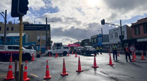 (230516) -- WELLINGTON, May 16, 2023 (Xinhua) -- Cordon lines are seen near the fire site of a hostel building in downtown Wellington, New Zealand, on May 16, 2023. Several people were killed and up to 30 others were believed unaccounted for after a blaze broke out overnight at a four-storey hostel building in downtown Wellington, police said on Tuesday. (Xinhua) Photo: Guo Lei/XINHUA