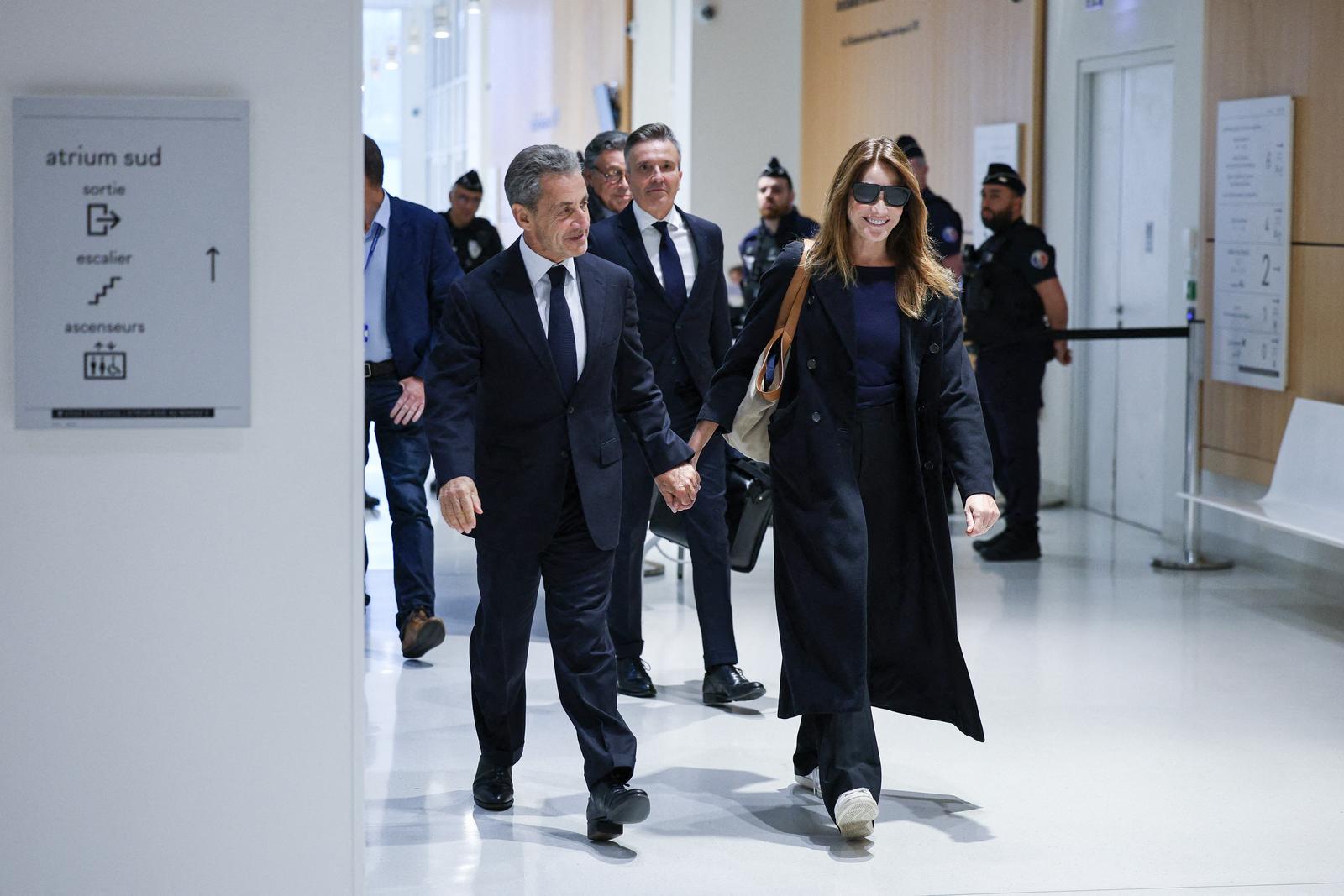Former French president Nicolas Sarkozy and his wife Carla Bruni arriving at verdict trial on charges of illegal campaign financing from Libya for his successful 2007 presidential bid, at the Tribunal de Paris courthouse in Paris, France on September 25, 2025. French prosecutors requested on March 27, 2025, a seven-year prison sentence for former president Nicolas Sarkozy in his trial on charges of accepting illegal campaign financing in an alleged pact with late Libyan dictator Moamer Kadhafi. Sarkozy, president from 2007-2012 and who denies the charges, was already convicted and jailed for one year in a separate influence-peddling case, a sentence he is currently serving with an electronic tag rather than in prison. Photo by Raphael Lafargue/ABACAPRESS.COM Photo: Lafargue Raphael/ABACA/ABACA