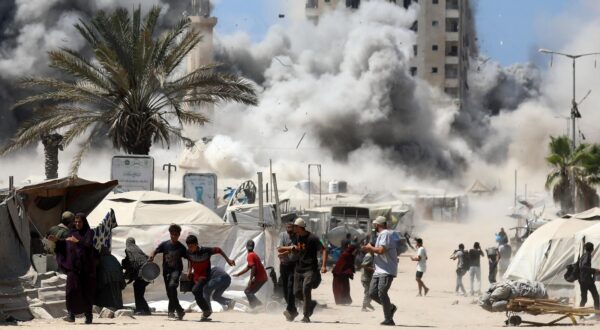 Palestinians run as smoke billows from the Mushtaha Tower after an Israeli airstrike shortly after the Israeli military announced its intention to target high-rise buildings, in Gaza City on Friday, September 5, 2025.   Photo by Omar Ishtiwi/UPI  Photo via Newscom Photo: Omar Ishtiwi/NEWSCOM
