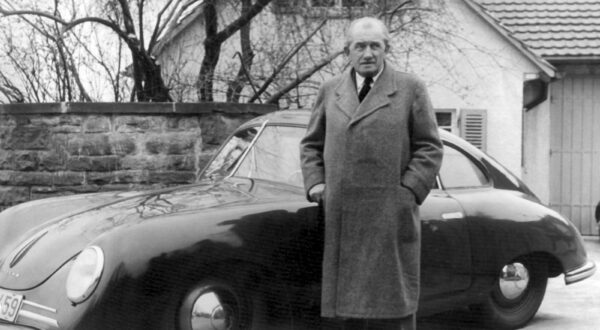Professor Dr. Ferdinand Porsche in front of his racy Porsche before his House.  March 27th 1950