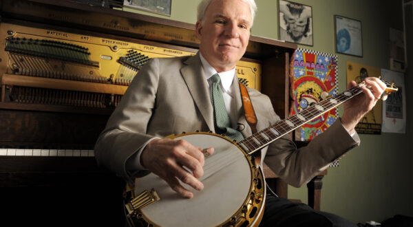 Actor, musician and writer Steve Martin practices with his banjo backstage before an appearance with the Steep Canyon Rangers band at Largo at the Coronet Theatre in Los Angeles, Friday, March 19, 2010. (AP Photo/Chris Pizzello)